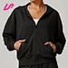 The black cropped zip up hoodie combines a modern, trendy look with soft, comfortable fabric, making it perfect for layering or casual wear with high-waisted bottoms.